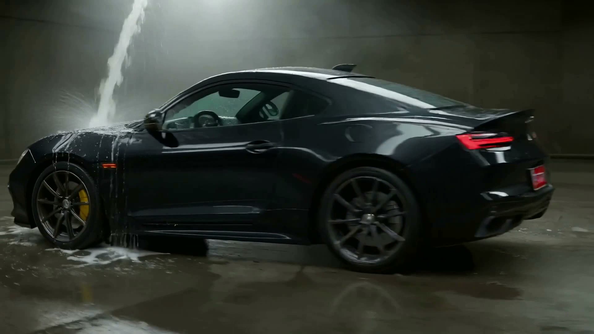 The Onyx Auto Spa studio in Cardiff — a black coupé under colour-corrected lighting